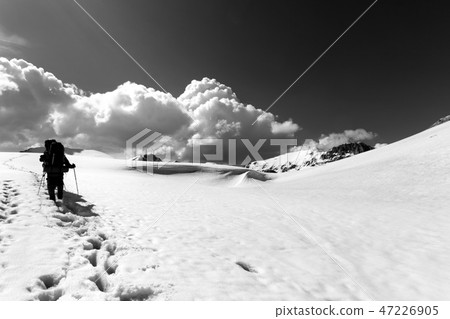 Two hikers on snowy plateau Two hikers on snowy plateau 47226905