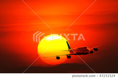 Big white airplane is flying over the sun Big white airplane is flying over the sun 47231524