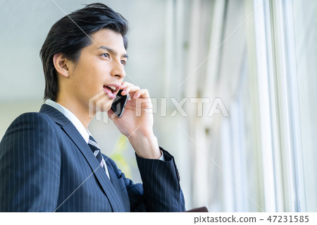 Male employee who calls a young businessman Male employee who calls a young businessman 47231585