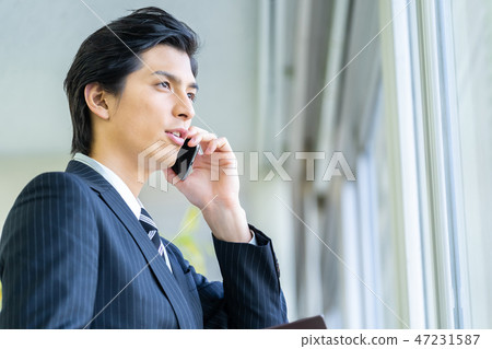 Male employee who calls a young businessman Male employee who calls a young businessman 47231587