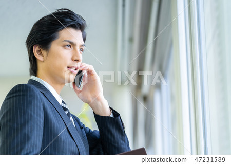 Male employee who calls a young businessman Male employee who calls a young businessman 47231589