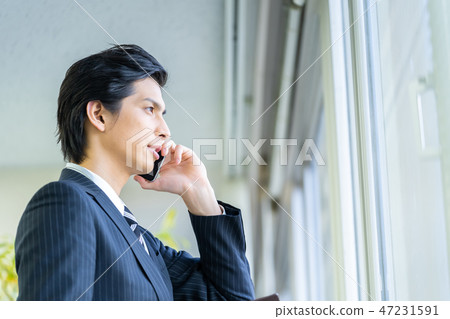 Male employee who calls a young businessman Male employee who calls a young businessman 47231591
