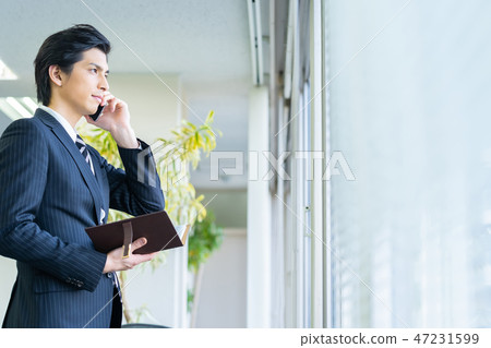 Male employee who calls a young businessman Male employee who calls a young businessman 47231599