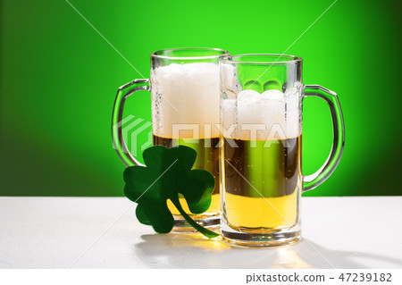 Two mugs of beer. Concept for St. Patrick's day. 47239182