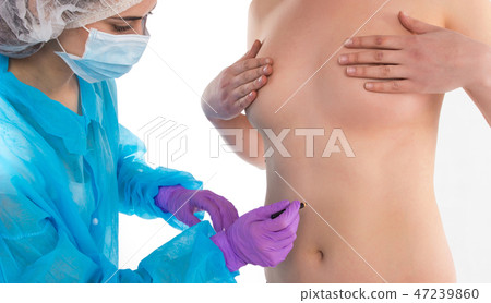 The doctor is drawing on a body 47239860