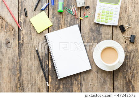 Office table with blank paper on old wooden table Office table with blank paper on old wooden table 47242572