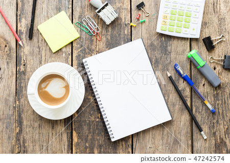Office table with blank paper on old wooden table Office table with blank paper on old wooden table 47242574