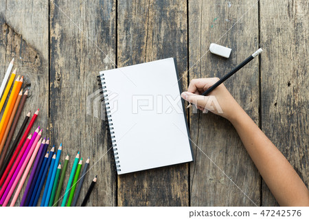 Girl hand drawing, blank paper and colorful pencil Girl hand drawing, blank paper and colorful pencil 47242576