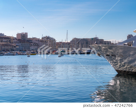 A stunning view of the old port of Marseille, France, with its marina and fishing boats coming and going. A stunning view of the old port of Marseille, France, with its marina and fishing boats coming and going. 47242766