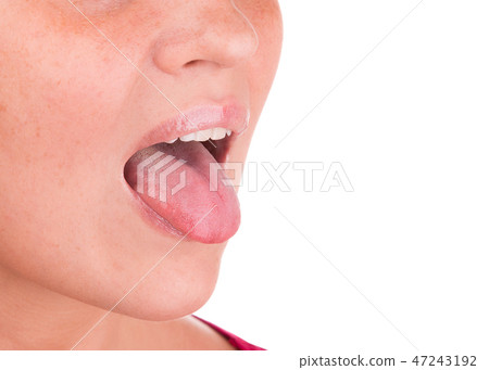 The girl shows tongue on a white background. The girl shows tongue on a white background. 47243192
