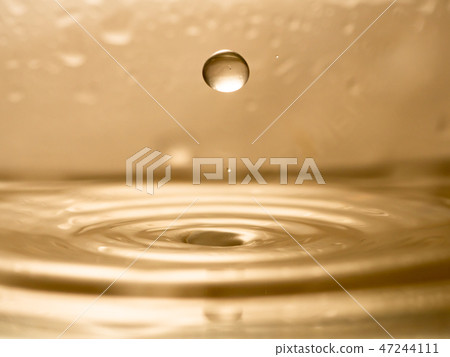 orange water splash isolated 47244111