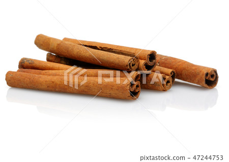 Cinnamon sticks on white background Cinnamon sticks on white background 47244753
