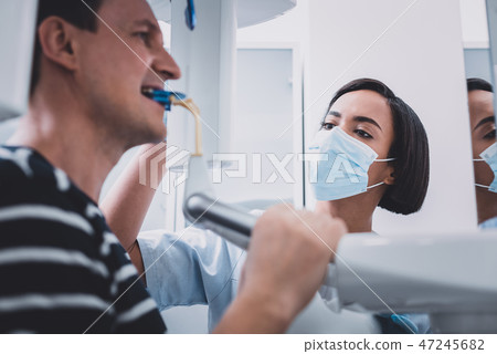 Focused photo on male hands that being on roentgen 47245682