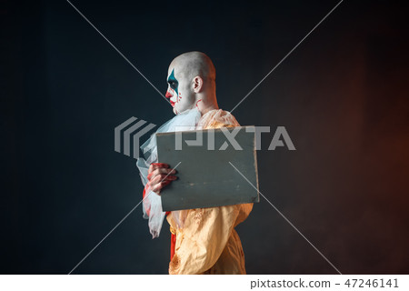 Portrait of scary bloody clown with crazy eyes Portrait of scary bloody clown with crazy eyes 47246141