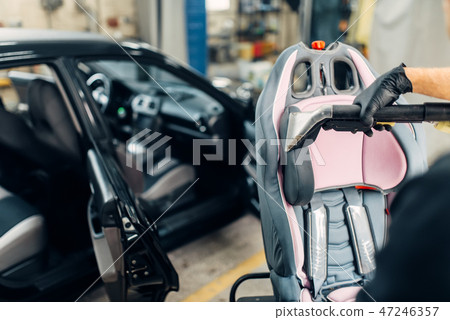 Carwash, removing of dust and dirt from child seat 47246357