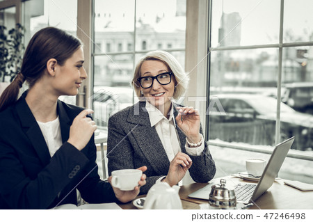 Stylish elegant businesswoman talking to her young secretary 47246498
