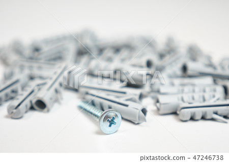 Plastic dowel pin or screw on white background 47246738