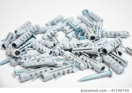 Plastic dowel pin or wall plugs on white background 47246749