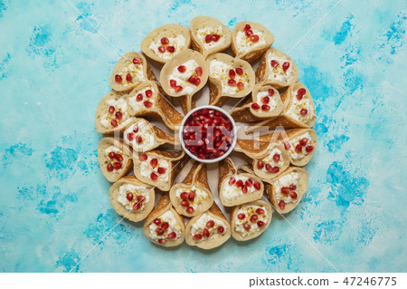 Traditional Arabic crepes stuffed with cream. Traditional Arabic crepes stuffed with cream. 47246775