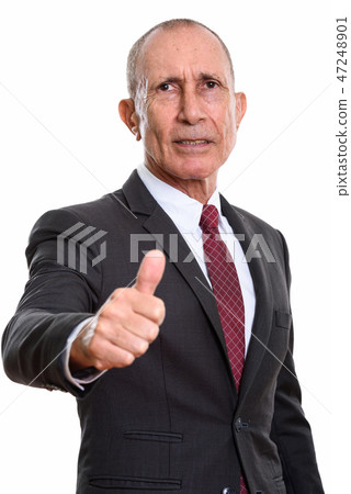 Studio shot of senior businessman giving thumb up 47248901