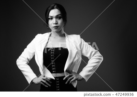Young beautiful Asian transgender businesswoman in black and whi Young beautiful Asian transgender businesswoman in black and whi 47249936