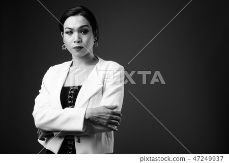 Young beautiful Asian transgender businesswoman in black and whi Young beautiful Asian transgender businesswoman in black and whi 47249937