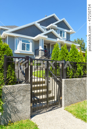Gate and step way to the terrace in front of the house 47250754