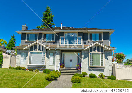 Big family house in suburbs of Vancouver on blue sky background. 47250755