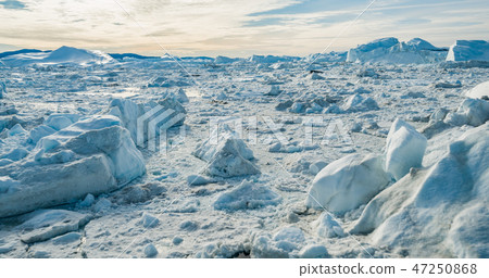 Global Warming and Climate Change - Icebergs from melting glacier on Greenland 47250868