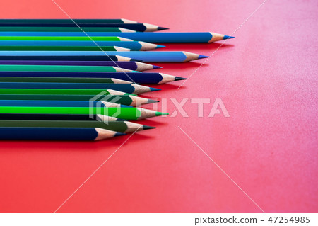 Teamwork concept. group of color pencil on red Teamwork concept. group of color pencil on red 47254985