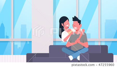 couple relaxing on couch man woman embracing sitting on sofa young happy lovers modern living room couple relaxing on couch man woman embracing sitting on sofa young happy lovers modern living room 47255960