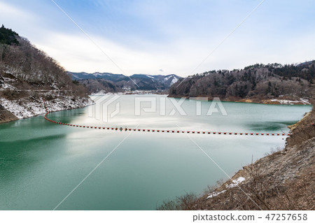 Kurikoma Dam and Lake Kurikoma and Dam Fence in Emerald Green 47257658