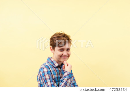 smug cheeky daring boy with skeptical smile 47258384