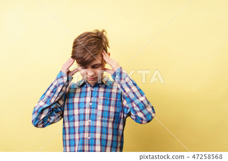stress, headache, mind overload boy clutching head 47258568