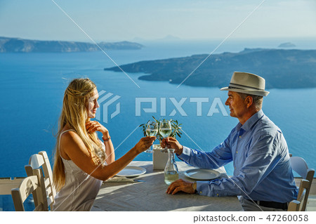 Couple having dinner on the background of the sea 47260058