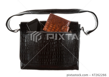 Phone and wallet sticks out of the pocket of bag 47262266
