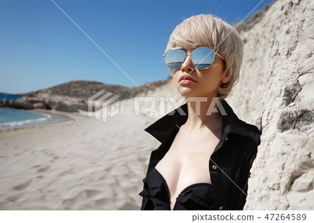 Beautiful slender woman in black tunic Beautiful slender woman in black tunic 47264589