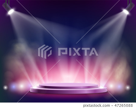 Spotlights illuminates a round stage. 47265088