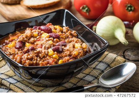 Chili con carne in a bowl. Chili con carne in a bowl. 47267572