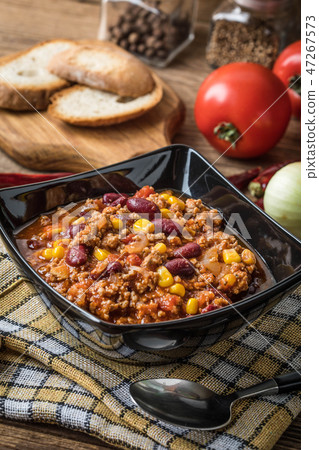 Chili con carne in a bowl. Chili con carne in a bowl. 47267573