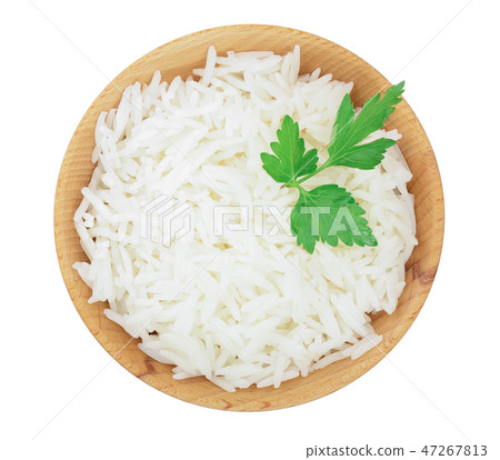 rice in a wooden bowl isolated on white background. Top view. Flat lay 47267813