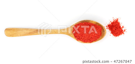 sweet paprika spice in a wooden spoon isolated on white background. Top view. Flat lay sweet paprika spice in a wooden spoon isolated on white background. Top view. Flat lay 47267847