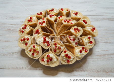 Qatayef, Arabian pancake stuffed with sweet cheese Qatayef, Arabian pancake stuffed with sweet cheese 47268774