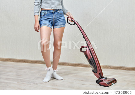 cleaning with help of upright vacuum cleaner. 47268905