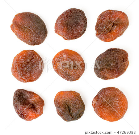 Set of dark dried apricots on a white. The form of Set of dark dried apricots on a white. The form of 47269388