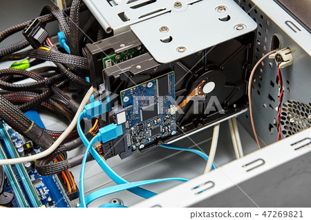 Unassembled PC with hard drive and cables. Unassembled PC with hard drive and cables. 47269821