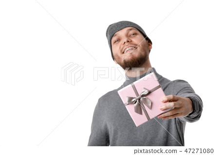 man in gray hat holding gift box on white background 47271080