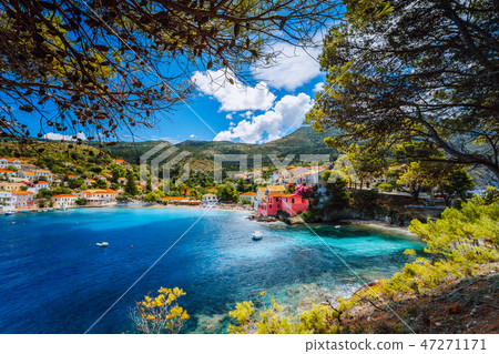 Beautiful blue bay in Assos village located on Kefalonia. Summer tourism vacation trip around Greece Beautiful blue bay in Assos village located on Kefalonia. Summer tourism vacation trip around Greece 47271171