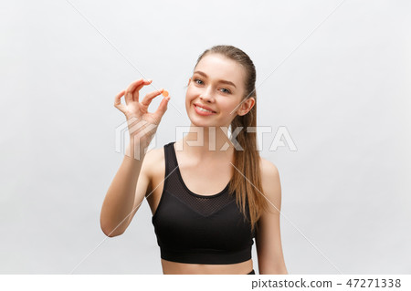 Supplements, Sports, Vitamins, Diet, Nutrition, Healthy Eating, Lifestyle. Close up of smiling Supplements, Sports, Vitamins, Diet, Nutrition, Healthy Eating, Lifestyle. Close up of smiling 47271338
