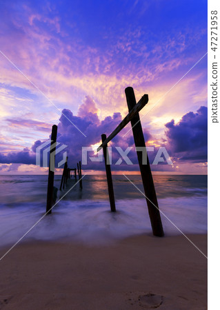 Beautiful sunset with old wooden bridge  47271958